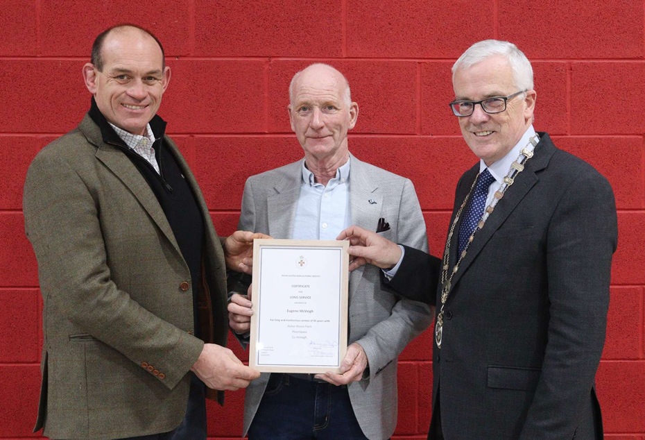 Eugene McVeigh from Poyntzpass was presented with a Long Service Award by RUAS President John Henning OBE, right, while also included is Simon Best, Acton House.