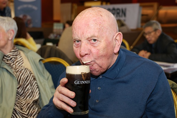 Enjoying a creamy pint at 'Discover & Connect.'