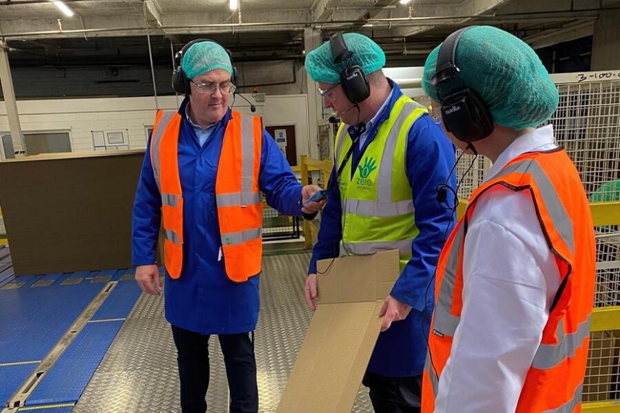 Minister Kimmins is pictured with Ciaran Rodgers and Kevin Kane during a visit to Saica Pack, Warrenpoint