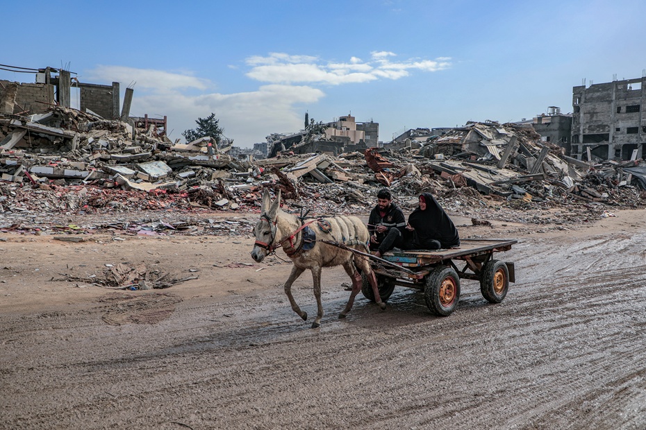 Amid the massive destruction in Jabalia camp, a young man and his mother drive a cart through the camp's streets. Photograph: Mohammed Ibrahim/ Unsplash