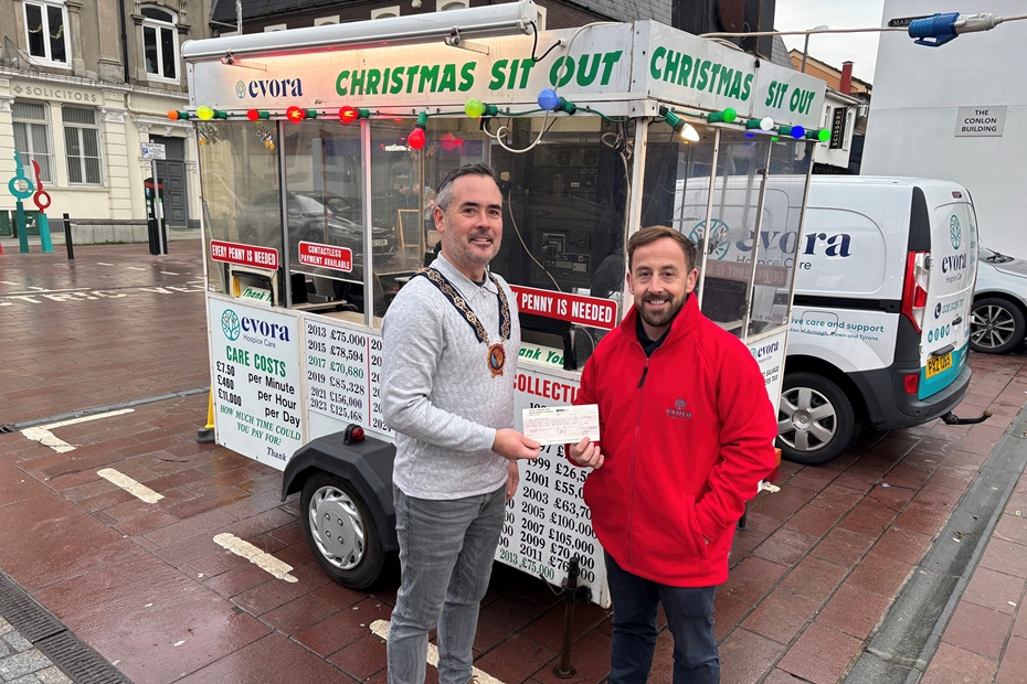 Newry, Mourne and Down District Council Chairperson Philip Campbell presenting Hospice Fundraising Officer James McCaffrey with a cheque to start the annual Evora Hospice fundraiser.