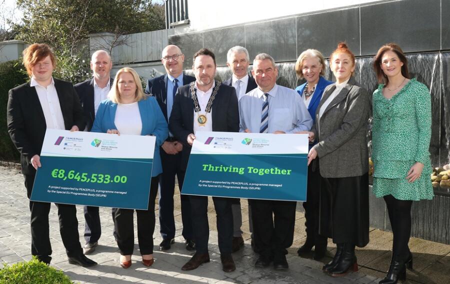 Newry, Mourne and Down District Council celebrates launch of €8.6million PEACEPLUS Local Action Plan. Pictured from left: Conor McNickle from The Executive Office; Conor Mallon, Economy, Regeneration and Tourism Director, Newry Mourne and Down District Council, Marie Ward, Chief Executive of Newry, Mourne and Down District Council; Paul Sheridan, Director of Corporate Services, (SEUPB); Cllr Peter Byrne, Chairperson of Council; Nicholas McCrickard, PEACEPLUS Partnership Board Deputy Chair, with Cllr Terry Andrews, Chair;  Josephine Kelly, Director of Corporate Services, Linda Sheridan, Assistant Principal Officer in the Department of Rural and Community Development (ROI); and Amanda Smyth Assistant Director, Economy, Regeneration and Tourism Director, Newry Mourne and Down District Council. 