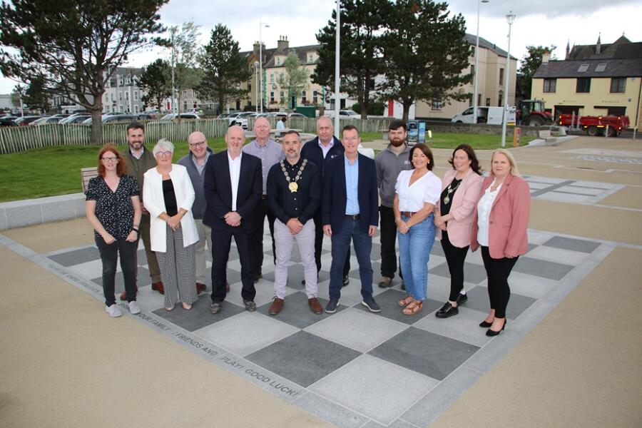 Newry, Mourne and Down District Council Chairperson, Cllr Philip Campbell celebrates the completion of works along Warrenpoint’s Front Shore - work which was carried out in partnership with the Department for Communities (DfC). He is photographed alongside representatives from DfC, AECOM (project consultants), John McQuillan contractors as well as Council project officers and senior managers.   L-R Angela Powell (NMDDC – Monitoring Officer), Robert Preston (AECOM Council Consultants), Bridgeen Murphy (DFC), Paul Jordan (NMDDC Project Co-Ordinator),Conor Mallon (NMDDC, Director Economy, Regeneration & Tourism), Seamus Crossey (NMDDC Project Manager – ERT), Councillor Philip Campbell (Chairperson NMDDC), Andy Clements (DFC),  Damien Mulholland (Deputy Director RDO, DFC), James Lynn (John McQuillan Contractors), Councillor Selina Murphy, Colleen Tinnelly, (President WBR Chamber of Commerce) and Marie Ward (CEO NMDDC).