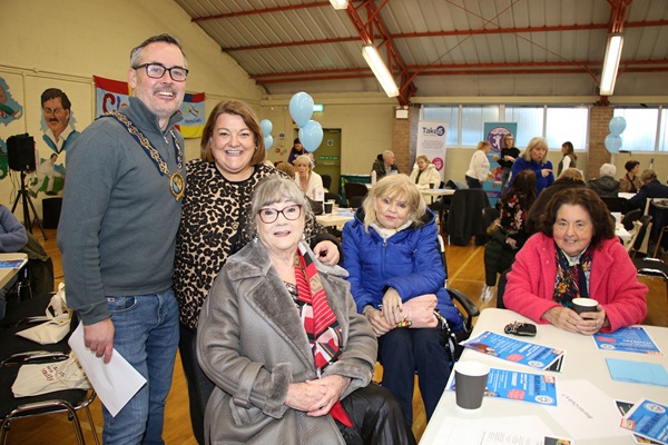 Newry, Mourne and Down District Council Chairperson Philip Campbell with Cathy Gallagher (second left) from Southern Age Well Network and some of the ladies who attended the Laugh Your Blues Away event at Cloughreagh Community Centre.  