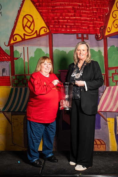Newry, Mourne and Down District Council Deputy Chairperson, Cllr Geraldine Kearns presents a commemorative vase to Catherine Farell from Newry Panto Players to mark their 50th anniversary.