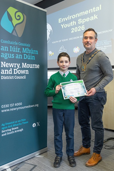 Luke Morgan from St. Ronan’s Primary School, Newry, with Newry, Mourne and Down District Council Chairperson Councillor Philip Campbell.