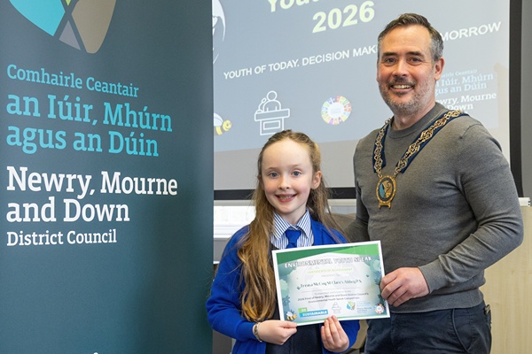 Treasa McCoy, from St Clare’s Abbey Primary School, Newry, with Newry, Mourne and Down District Council Chairperson, Councillor Philip Campbell.