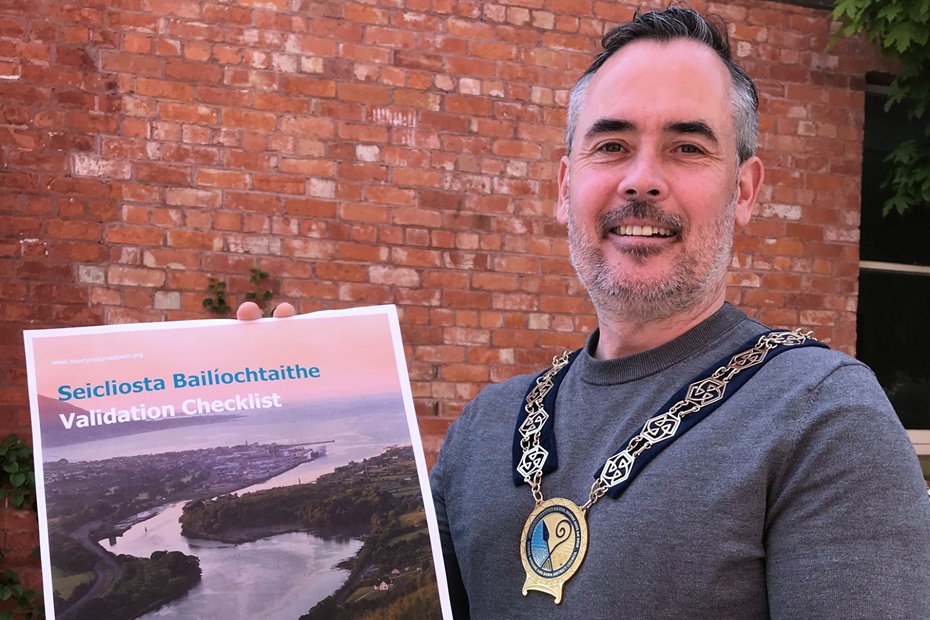 Councillor Philip Campbell, Chairperson, Newry, Mourne and Down District Council with the checklist.