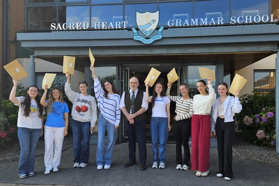 Principal, Shane Comer, with some of the successful A Level students receiving their results.