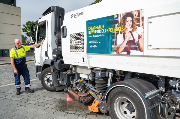 Newry, Mourne and Down District Council Cleansing Staff Paddy Taggart alongside the Council’s new street cleansing sweeper vehicle.
