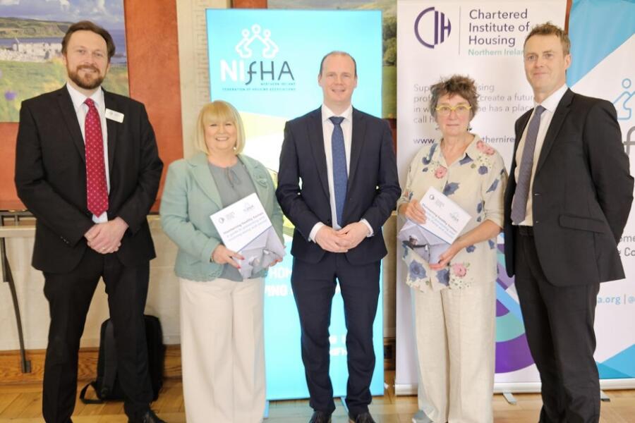 Launching a new guide for housing professionals and tenants on damp and mould are from left: ustin Cartwright CIH national director, Carol McTaggart CIH chair, Communities minister Gordon Lyons, Hazel Bell NIFHA chair and Seamus Leheny NIFHA chief executive. 