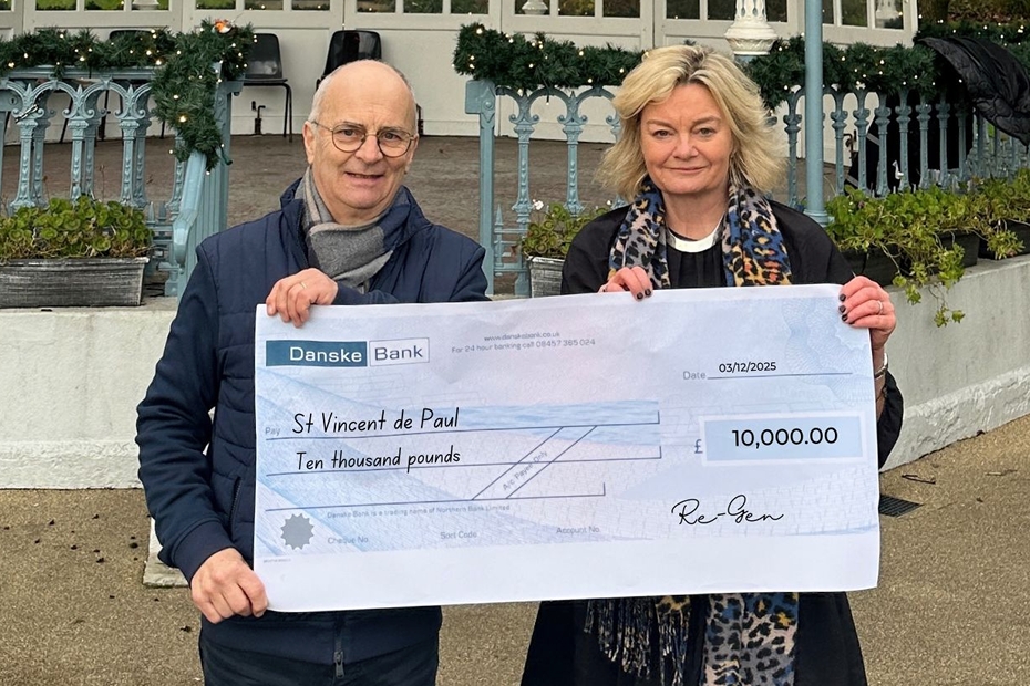 Michael Gilfedder, St Vincent de Paul receives a cheque for £10.000 from Candida Brown, Re-Gen.