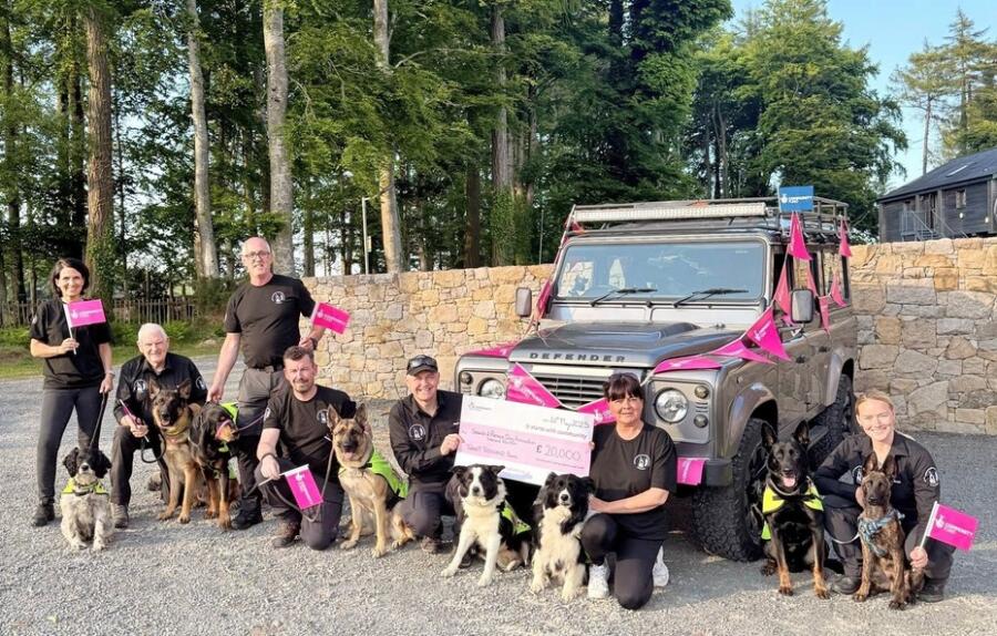 Volunteers and their Search Dogs with their replacement Land Rover. (L-R) Aurelie Moralis and Nelly, Dr Neil Powell and Biorche, David Gamble and Magnus, Declan Patton and Harley, Raph O’Connor and Floss, Clair O’Connor and Bee, Rosie Rowbotham and Fenrir (and puppy Odin). The group was awarded a £20,000 grant from The National Lottery Community Fund to buy an off-road vehicle to help the group to deliver their search and rescue services. Photograph: Search and Rescue Dogs (Ireland North) 