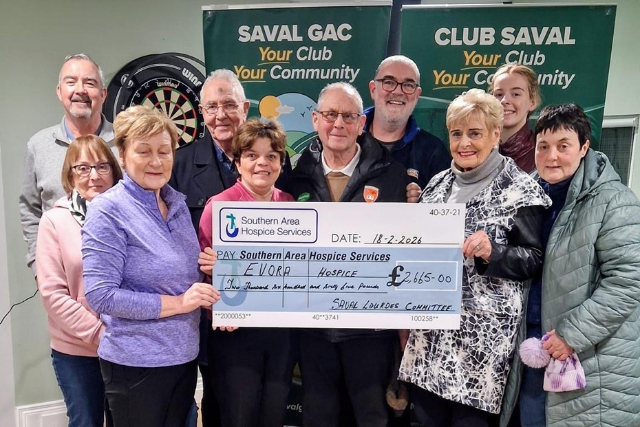 Members of Saval Lourdes Committee present a cheque to Geraldine Lambe from Evora Hospice.