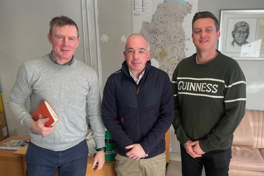 MLA Justin McNulty, left and Cllr Killian Feehan, right with Derek Hynes, NIE