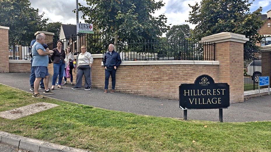 Cllr Declan Murphy and Infrastructure Minister Liz Kimmins with residents at Hillcrest Village.