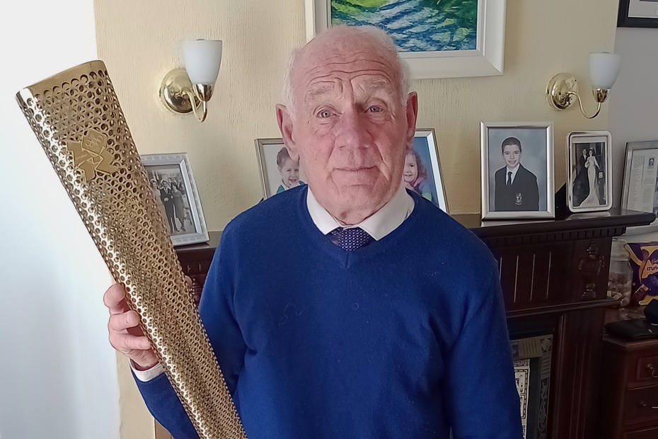 Willie McCracken with the 2012 Olympic Torch. Photograph: Joseph Linden