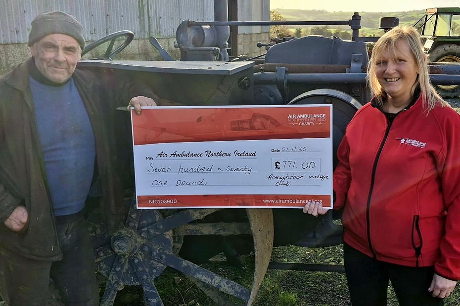 Alan Gilliespie from ArmaghDown Vintage Club presents Irene Crawford from Air Ambulance with a cheque for £771