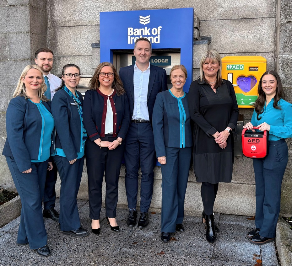 The Bank of Ireland Newry team with Brian Berkery, Health & Safety Manager, Bamk of Ireland, launch the new defibrillator which has been installed at the branch for commumity use.