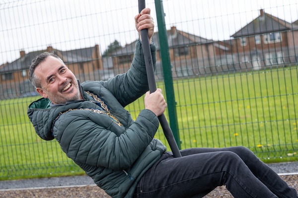 Councillor Philip Campbell embracing the zip line at Kilkeel’s Scrogg Road Play Park.