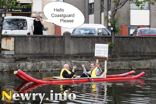 Mayor Charlie Casey and Pat Courtney, Courtneys Restaurants put on a brave face and try to keep the plug in the bath as Paddy Duffy makes an important call