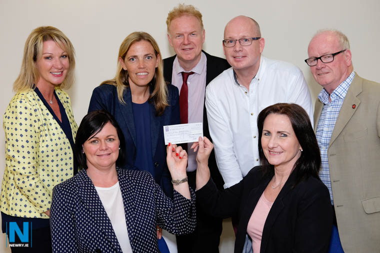 Clanrye Abbey Developments pressented a cheque for £10,000 to Newry Rugby Club to assist with urgent repairs to its outdated changing facilities for its burgeoning youth section as well as rewiring and re-plumbing of the clubrooms. Pictured holding their cheque are Karen McNally, Newry Rugby Club Secretary and Nicki Kinsella, Treasurer while looking on are Clanrye Abbey Developments Board Members, back from left: Ciara Blaney, Director; Jane Magill, Secretary; Brendan Jackson, Treasurer; Michael Savage, Chair and Peter McEvoy, Director. Photograph: Columba O'Hare