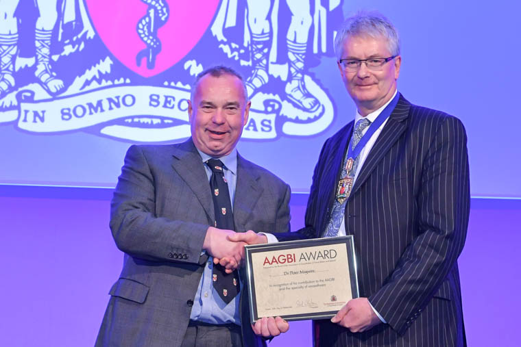 Dr Peter Maguire receives his Award from the President of the Association of Anaesthetists of Great Britain and Ireland, Dr Paul Clyburn Dr Peter Maguire receives his Award from the President of the Association of Anaesthetists of Great Britain and Ireland, Dr Paul Clyburn