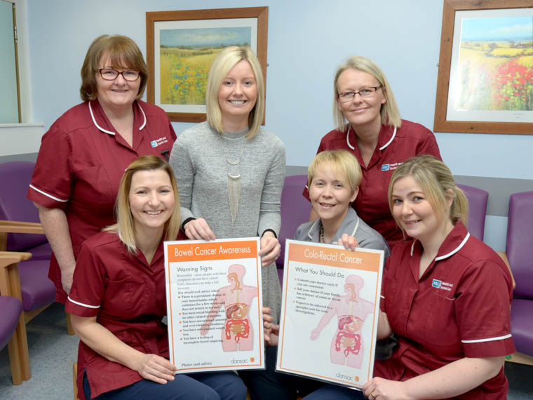   The Southern Trust Colorectal Nursing Team are marking Bowel Cancer Awareness Month Back L-R: Bernie Trainor (Stoma/ Coloproctology Nurse), Stacy Leathem, Macmillan Support Worker, Fiona Keegan, Macmillan Colorectal Cancer Nurse Specialist. Front L-R: Claire Young (Stoma/ Coloproctology Nurse), Cheryl Bleakney (Administrative Assistant), Lynn Berry (Stoma/ Coloproctology Nurse) Missing from photo: Tanya Garvie (Stoma/ Coloproctology Nurse).  