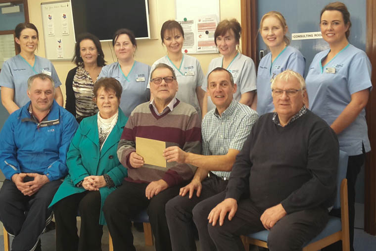 Pictured making the presentation at Daisy Hill Hospital are back from left: Staff Nurse, Carolyn Hutchinson, Helen McCaul, Service Administrator, Staff Nurse Aine Hunter, Cathy McDowell, Health Care Assistant, Mercedes McAteer Health Care Assistant, Staff Nurse Ursula O’Riordan, Staff Nurse Georgina Byrne. Front from left: Mr Mark Greenaway, Mrs Doreen Greenaway, Mr John Greenaway, Dr John Harty, Consultant Nephrologist, Mr Roland Greenaway.