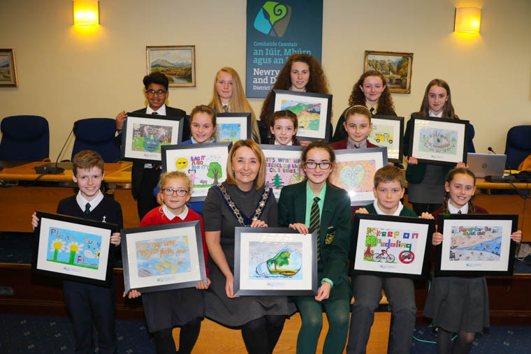 Chairperson Newry, Mourne and Down Council, Councillor Roisin Mulgrew with the School's Environmental Calendar Poster Competition Winners. back row l-r Sharath Chandra Vadiyala (October Winner), Abbey CBS Newry, Litter is the World's Biggest Nightmare, Alice Ballentine (May Winner), Shimna Integrated College Newcastle, Keep Our Sea Debris Free, Kathleen McEvoy (July Winner) Our Lady's Grammar School Newry, Stop Pollution Now, Cara Donaghy (September Winner), Saint Joseph's High School Crossmaglen, Take the Bus, It's a lot less fuss and it saves the Environment thats a plus, Ellie Jo McCabe (November Winner), Saint Malachy's High School Castlewellan, Save Our World. Middle row l-r Lily Ferguson (March Winner), Annalong Primary School, Bag It - Big It Dog Fouling, Lucia Vallely (December Winner), Saint Malachy's Primary School Ballymoyer, Let's Wrap up Recycling this Christmas, Reannah Patterson (February Winner), Kilkeel High School, I Gotta Dash - Pick Up Trash. Front row l-r Peter Kelly (April Winner), Ballyholland Primary School, Plant  Busy Bee Flowers, M&eacute;abh Hull (August Winner), Saint Joseph's Primary School Strangford, Save Our Seas - Recycle Plastic Please, Chairperson Newry, Mourne and Down Council, Councillor Roisin Mulgrew with Front Cover Winner Katie McGivern Sacred Heart Grammar School Newry, Think Green - Live Green, Donnchadh Murdock (June Winner), Carrick Primary School Burren, Keep on Pedaling - No Cars, Sarah Jane McNally (January Winner) Saint Colman's Primary School Saval, Remember The Colour Code.