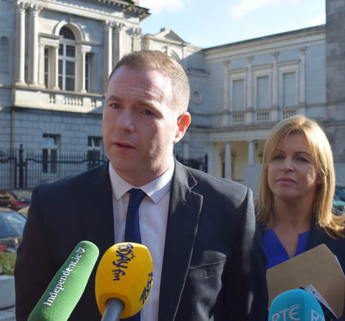 Chris Hazzard MP speaking to the gathered media outside D&aacute;il &Eacute;ireann on Thursday afternoon. 