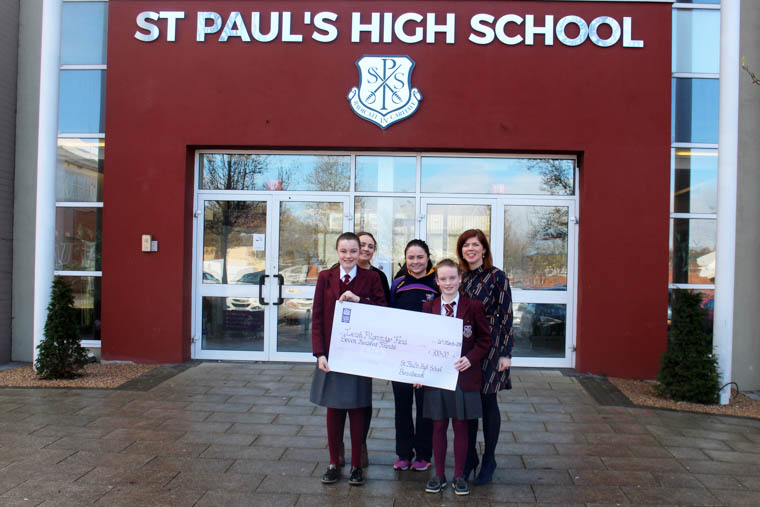 Niamh Rafferty of the Irish Pilgrimage Team accepts a cheque from Siofra Brennan and Aime McNally. Also in the picture is Mrs Marion McMahon, Siofra's form teacher and Niamh Watters, who will also travel to Lourdes at Easter.