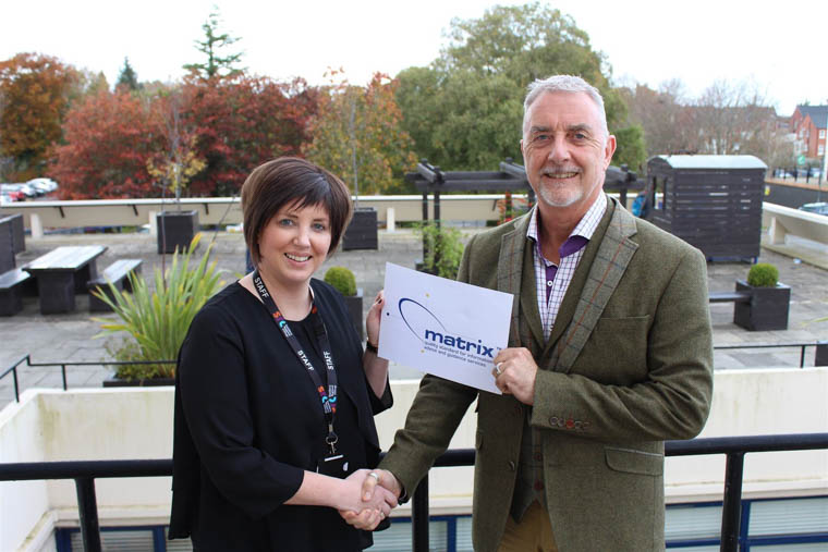 Lorraine McKeown SRC Assistant Director for Student Services and Marketing receiving the Matrix Award from Matrix Assessor Andy Richardson. Lorraine McKeown SRC Assistant Director for Student Services and Marketing receiving the Matrix Award from Matrix Assessor Andy Richardson.