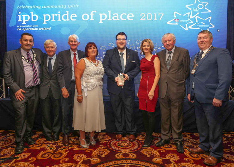 Representatives from Newry Rainbow Community receive their award in the Social Inclusion and Equality Initiative category at the Co-operation Ireland/Irish Public Bodies Pride of Place Awards . Included from left are: Cllr William Clarke, Deputy Chairperson, Newry, Mourne and Down Council; Dr Christopher Moran, Chairman Co-operation Ireland; Tom Dowling, Chairperson, Pride of Place; Karen Rafferty, NRC; Rory Rafferty, Chairperson, NRC; Kerry Morrow, Good Relations, Newry, Mourne and Down Council; Michael McGreal, Vice Chair IPB Insurance; and Cathaoirleach of Donegal County Council, Cllr Gerry McMonagle. Photograph: Lorcan Doherty Representatives from Newry Rainbow Community receive their award in the Social Inclusion and Equality Initiative category at the Co-operation Ireland/Irish Public Bodies Pride of Place Awards . Included from left are: Cllr William Clarke, Deputy Chairperson, Newry, Mourne and Down Council; Dr Christopher Moran, Chairman Co-operation Ireland; Tom Dowling, Chairperson, Pride of Place; Karen Rafferty, NRC; Rory Rafferty, Chairperson, NRC; Kerry Morrow, Good Relations, Newry, Mourne and Down Council; Michael McGreal, Vice Chair IPB Insurance; and Cathaoirleach of Donegal County Council, Cllr Gerry McMonagle. Photograph: Lorcan Doherty