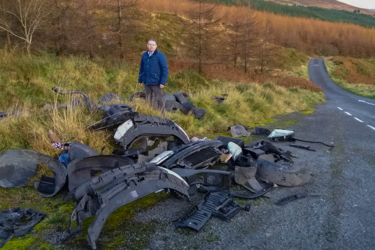 Cllr Mickey Larkin pictured beside the dumped material on the Slieve Gullion Drive. Cllr Mickey Larkin pictured beside the dumped material on the Slieve Gullion Drive.