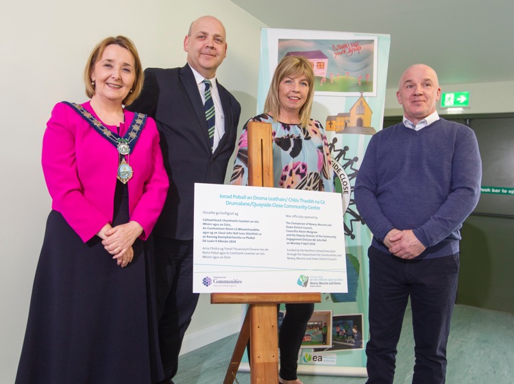 Newry, Mourne and Down District Council Chairperson Councillor Roisin Mulgrew, Department for Communities Deputy Director Community Empowerment Division Mr John Ball, Chairperson of Newry Neighbourhood Renewal Partnership Geraldine Merendino and Chairperson of Drumalane/Quayside Close Association Gerard Hutchinson unveil the commemorative plaque at the official opening of Drumalane/Quayside Close Community Centre. Newry, Mourne and Down District Council Chairperson Councillor Roisin Mulgrew, Department for Communities Deputy Director Community Empowerment Division Mr John Ball, Chairperson of Newry Neighbourhood Renewal Partnership Geraldine Merendino and Chairperson of Drumalane/Quayside Close Association Gerard Hutchinson unveil the commemorative plaque at the official opening of Drumalane/Quayside Close Community Centre.