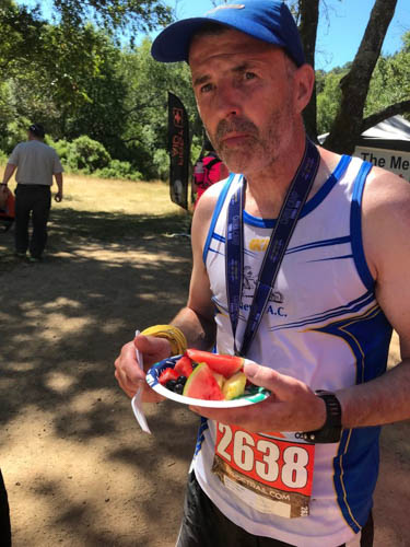 Ronan Mynes rewarded with fresh fruit at the finish line of Camp China HM Trail Race in California Ronan Mynes rewarded with fresh fruit at the finish line of Camp China HM Trail Race in California