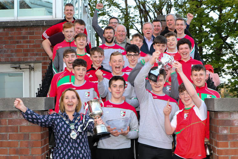Craobh Rua Under 16 Hurlers with managers, coaches and committee members celebrate their success with Newry, Mourne and Down District Council Chairperson, Councillor Roisin Mulgrew. Craobh Rua Under 16 Hurlers with managers, coaches and committee members celebrate their success with Newry, Mourne and Down District Council Chairperson, Councillor Roisin Mulgrew.