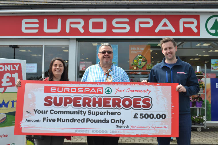 The first ever EUROSPAR Super Dad, Mark Reid, is pictured (centre) with his daughter Emma and Daniel Comiskey from Henderson Group, owners of the EUROSPAR brand in Northern Ireland. This is the final chance to nominate a hero dad from local communities across NI The first ever EUROSPAR Super Dad, Mark Reid, is pictured (centre) with his daughter Emma and Daniel Comiskey from Henderson Group, owners of the EUROSPAR brand in Northern Ireland. This is the final chance to nominate a hero dad from local communities across NI