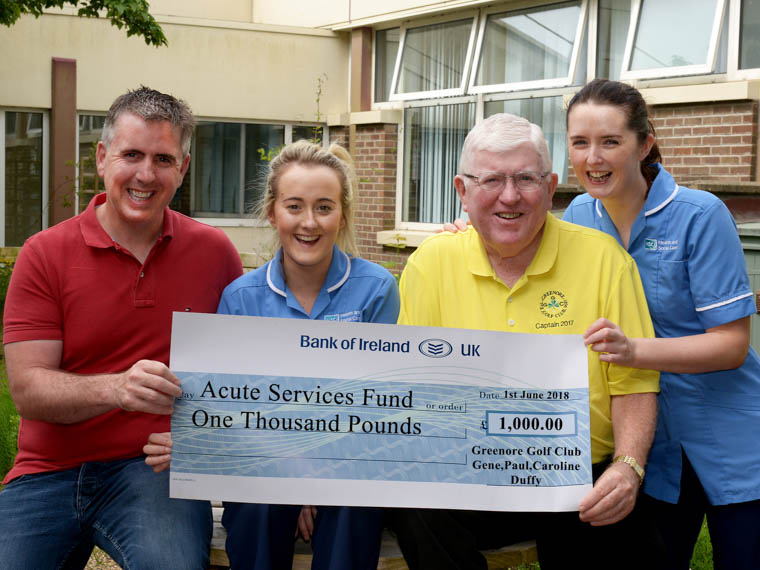 Gene and Paul Duffy presents the cheque to Lyndsey McManus and Elizabeth McArdle.