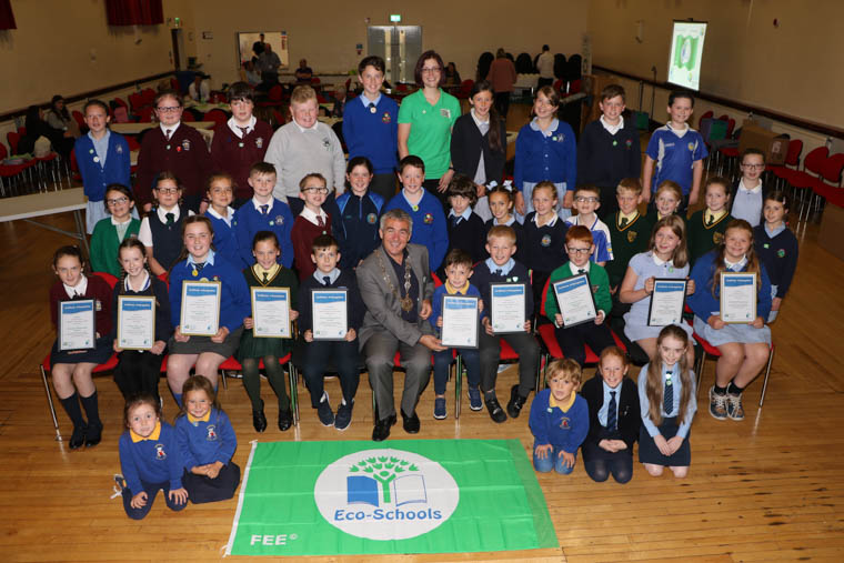 Cathy Gorman Eco Schools Officer, Keep Northern Ireland Beautiful and Cllr Mark Murnin, Chairperson Newry, Mourne and Down District Council with the Eco Councils from ten primary schools, including St Peter's PS Cloughreagh, St. Patrick's PS Hilltown, St. Mary's PS Mullaghbawn, Castlewellan PS who each received their 1st Green Flag, Windsor Hill PS Newry wo received their 2nd Flag, St Laurence O'Toole PS Belleeks who received their 3rd Flag, St. Bronagh's PS Rostrevor with their 3rd Flag, St. Malachy's PS Carnagat with their 4th Flag, Cumran PS Clough Downpatrick with their 8th Flag and Downpatrick Nursery School with their 10th Flag. Cathy Gorman Eco Schools Officer, Keep Northern Ireland Beautiful and Cllr Mark Murnin, Chairperson Newry, Mourne and Down District Council with the Eco Councils from ten primary schools, including St Peter's PS Cloughreagh, St. Patrick's PS Hilltown, St. Mary's PS Mullaghbawn, Castlewellan PS who each received their 1st Green Flag, Windsor Hill PS Newry wo received their 2nd Flag, St Laurence O'Toole PS Belleeks who received their 3rd Flag, St. Bronagh's PS Rostrevor with their 3rd Flag, St. Malachy's PS Carnagat with their 4th Flag, Cumran PS Clough Downpatrick with their 8th Flag and Downpatrick Nursery School with their 10th Flag.