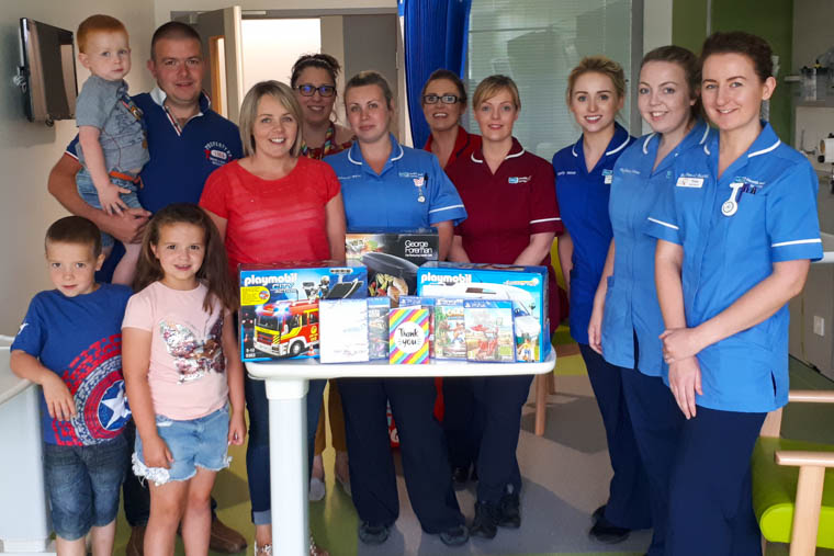 Making the donation to some of the staff at the Daisy Children and Young People&rsquo;s Unit are Lucy&rsquo;s parents David and Stephanie Parke and siblings Jake, Jenny and Ben.