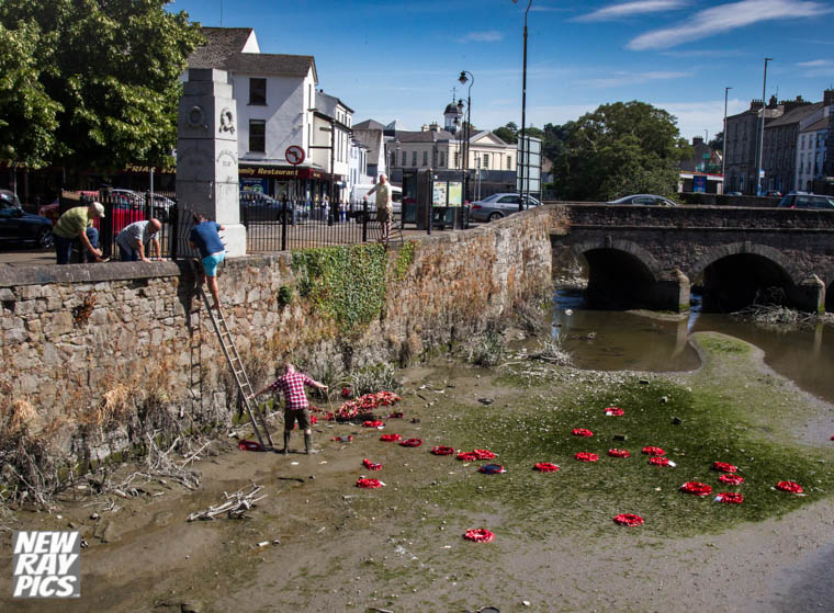 Local people retrieve wreaths from the Clanrye River in Newry after they had been taken off the Cenotaph and thrown in overnight. Photograph: NewRayPics Local people retrieve wreaths from the Clanrye River in Newry after they had been taken off the Cenotaph and thrown in overnight. Photograph: NewRayPics