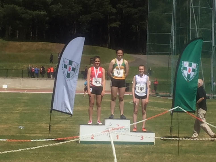 Meadow McCauley lifting Bronze at NI Ulster Championships for 250m Hurdles
