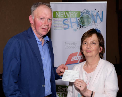 Newry Show presented a cheque to Southern Area Hospice at the launch of their 2018 Show. Eamon Fitzpatrick, Treasurer, Newry Show is pictured presenting the cheque for £500 to Carmel McKenna who received it on behalf of the hospice. Photograph: Columba O'Hare/ Newry.ie Newry Show presented a cheque to Southern Area Hospice at the launch of their 2018 Show. Eamon Fitzpatrick, Treasurer, Newry Show is pictured presenting the cheque for £500 to Carmel McKenna who received it on behalf of the hospice. Photograph: Columba O'Hare/ Newry.ie