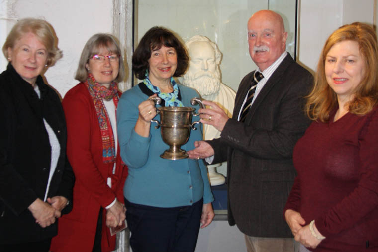 Presentation of the silver cup to Newry and Mourne Museum. L-R: In front of bust of James MacGeorge: Sue Coles, Sheila Pocock, Kate Pocock, Councillor Charlie Casey and Noreen Cunningham, Museum Curator. Presentation of the silver cup to Newry and Mourne Museum. L-R: In front of bust of James MacGeorge: Sue Coles, Sheila Pocock, Kate Pocock, Councillor Charlie Casey and Noreen Cunningham, Museum Curator.