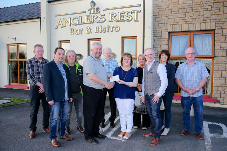 Howard Anderson, Chairman of Rathfriland Motorcycle Club presents a cheque to Sheila Carragher and friends of Newry & Mourne M.S. Community Therapy Centre Ltd while members of the club look on. Howard Anderson, Chairman of Rathfriland Motorcycle Club presents a cheque to Sheila Carragher and friends of Newry & Mourne M.S. Community Therapy Centre Ltd while members of the club look on.