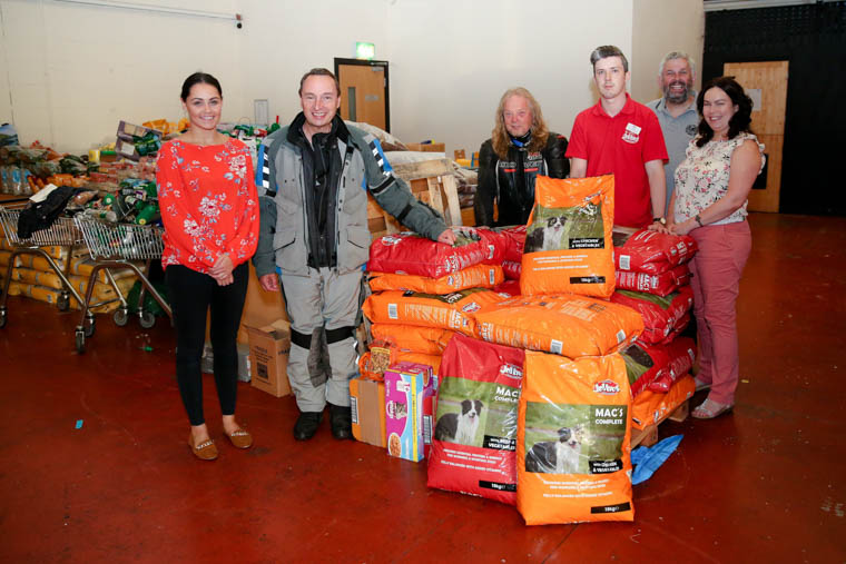 Sarah Loughran from the USPCA, Alan Dowdeswell, JD Hanlon, Lance Best from Jolleys, Howard Anderson, and Colleen Dowdall from the USPCA with the supply of pet food.