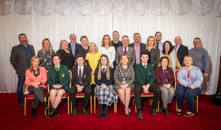 Pupils and teachers from Our Lady's Grammar school, Sacred Heart Grammar School, Newry, St. Paul's High School, Bessbrook, St. Joseph's Boys High School, Newry and St. Mark's High School, Warrenpoint., with Chairperson, Cllr Roisin Mulgrew,  MP Chriz Hazzard, MLAs Sinead Enis and Emma Rogan and local Councillors.