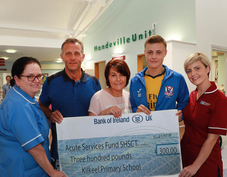 Sam, Deirdre and Ryan Stevenson of Millbay Road Kilkeel present a £300 cheque to Craigavon Are Hospital Mandeville Unit staff Tanya Maginn and Laura Creaney Sam, Deirdre and Ryan Stevenson of Millbay Road Kilkeel present a £300 cheque to Craigavon Are Hospital Mandeville Unit staff Tanya Maginn and Laura Creaney